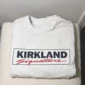Kirkland Signature White crew neck sweater with Red and Black Logo